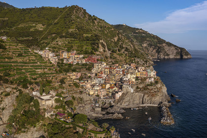 Italy, Liguria, Cinque Terre National Park listed as World Heritage by UNESCO, village of Manarola and its harbour (aerial view)