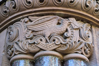 France, Moselle, Metz, Imperial district, former central  post office, neo-Romanesque building built in 1905, column pediment showing a homing pigeon delivering a letter