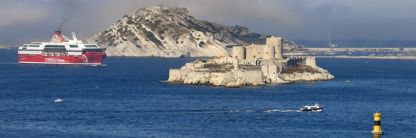 France, Bouches du Rhone, Marseille, Calanques National Park, archipelago of Frioul islands, Corsica Linea Ferry arriving from Corsica and the Chateau d'If in the foreground
