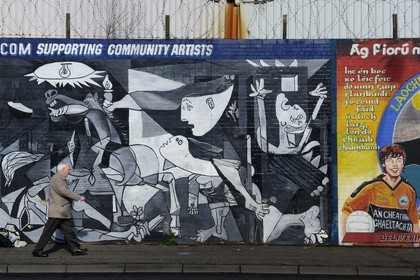 United Kingdom, Northern Ireland, West Belfast, Catholic Falls area, International or Solidarity Wall, murals on Falls Road, resumption of Picasso's Guernica by a Catholic and a Protestant in a duet work