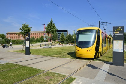 France, Haut Rhin, Mulhouse, tram in front of the Cite de l'Automobile - National Museum, Schlumpf Collection rehabilitation by Studio Milou Architecture