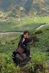 Vietnam, Lao Cai province, Sapa district, young woman from the Black Hmong minority group overlooking her valley Hau Thao