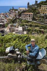 Italy, Liguria, Cinque Terre National Park listed as World Heritage by UNESCO, village of Vernazza, Bartolomeo Lercari, owner and operator of DO Liguria di Levante Cheo wines on his cogwheel monorail for harvesting on these extremely steep lands