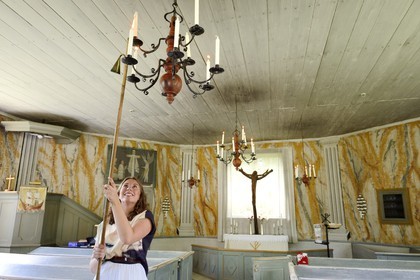 Sweden, Vasterbotten County, Umea, Gammlia Open-Air Museum and Vasterbotten museum, the Helena Elisabeth Church originally a fishermen's chapel on the island of Holmö from 1803, candle lighting