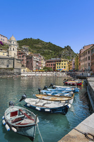 Italy, Liguria, Cinque Terre National Park listed as World Heritage by UNESCO, village of Vernazza, boats in the harbor