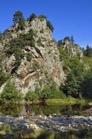 France, Haute Loire, Loire river Valley, Arlempdes, labelized the Most Beautiful Villages of France, hiker going up the gorges of the Loire river and its basaltic cliffs