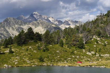 France, Hautes Pyrenees, Saint Lary Soulan and Vielle-Aure, hike on a variant of the GR10 between the Portet pass and the Bastan lakes on the edge of the Neouvielle nature reserve, lower Bastan lake and the Neouvielle massif in the background