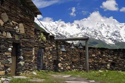 Georgia, Upper Svaneti (Zemo Svaneti), village of Ushguli, listed as World heritage by UNESCO, Lamaria St. Mary's church of Ushguli from the 12th century and Mount Chkhara (highest peak in Georgia with 5,193 m) in the background
