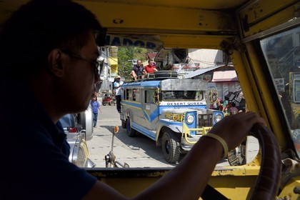 Philippines, Ifugao province, Banaue town, jeepney (elongated jeep to transport passengers) on the main square