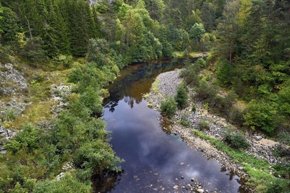 France, Haute Loire, Loire river Valley, Salettes, hiker along the banks of the Loire river at the Pont de Soubrey