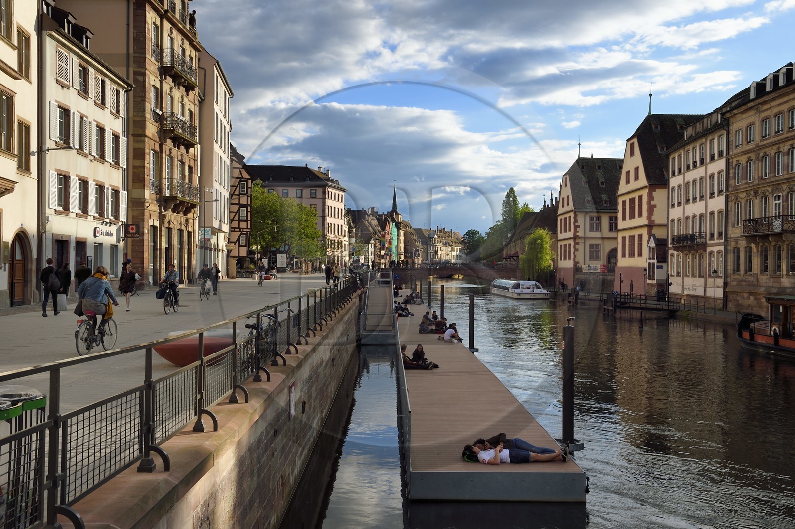 France, Bas Rhin, Strasbourg, old town listed as World Heritage by UNESCO, banks of Ill River quai des Bateliers turned into a meeting place for pedestrians, a floating pontoon is put in place to get closer to the river France, Bas Rhin, Strasbourg, old town listed as World Heritage by UNESCO, banks of Ill River quai des Bateliers turned into a meeting place for pedestrians, a floating pontoon is put in place to get closer to the river