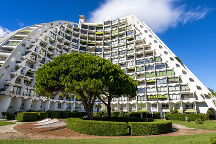 France, Herault, La Grande-Motte, labeled 20th century heritage, The Great Pyramid built in 1974 by the architects Jean Balladur and Jean-Bernard Tostivint, this flagship building for the port of the seaside resort dominates the whole city, forms a curved Y plan and houses a hotel and apartments