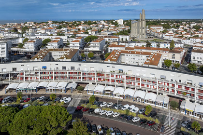 France, Charente-Maritime, Royan, Front de Mer building and Notre-Dame de Royan church built from 1955 to 1958 by architect Guillaume Gillet in the background (aerial view)