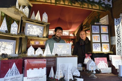 France, Haut Rhin, Strasbourg, Kaysersberg, Pascal (and Catherine) Thevenin with his son Lucas from Editions Lisele create canivets in the art of cut paper to stylize Christmas decorations in particular