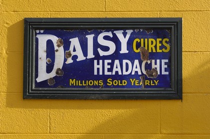 Republic of Ireland, County Kildare, Naas, old adverts on a pub 's wall