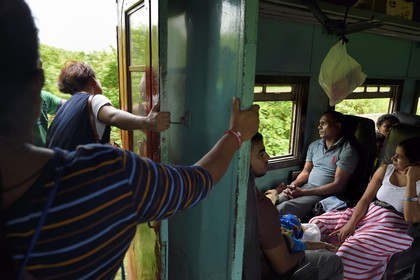 Sri Lanka, Western Province, train from Galle to Colombo, the train moves with open doors