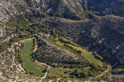 France, Herault, the Causses and the Cevennes, Mediterranean agro pastoral cultural landscape, listed as World Heritage by UNESCO, Saint Maurice Navacelles, Cirque de Navacelles, the rock of the Virgin is surrounded by a oxbow of the river La Vis (aerial view)