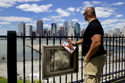 United States, New York, Downtown Manhattan seen from the Promenade in Brooklyn, the Time magazine announcing the death of Bin Laden facing the site of the attacks of September 11, 2001 on the twin towers of the World Trade Center