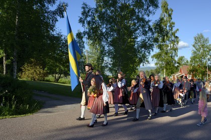 Sweden, Dalarna County, Leksand area, parade in traditional costume for the Midsummer celebrations in the tiny hamlet of Hjulbäck