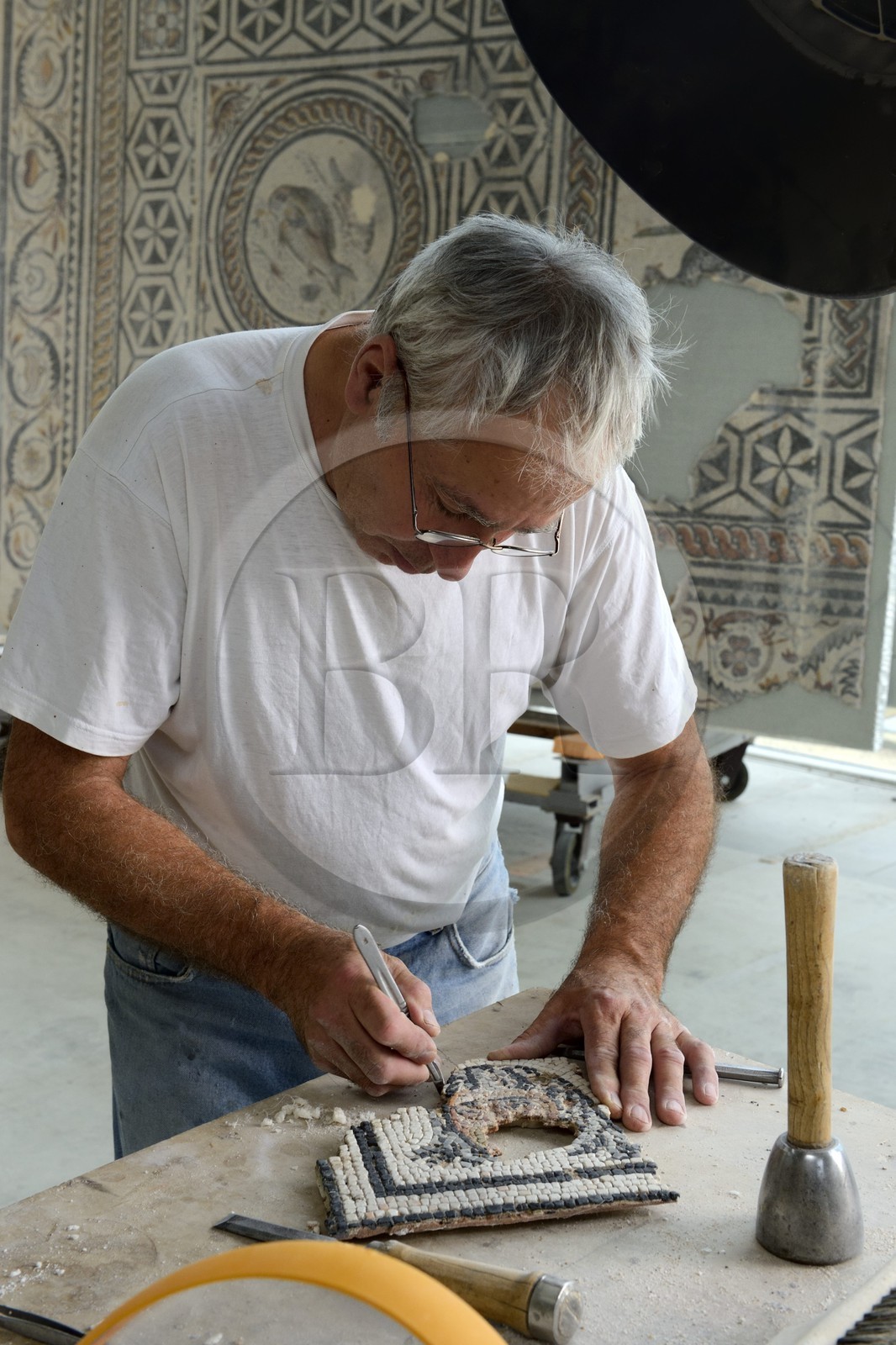 France, Rhone, Lyon, Saint Romain en Gal, Gallo-Roman Museum of Saint-Romain-en-Gal mosaics restoration workshop, restoration of a 2nd century mask of the house five mosaics