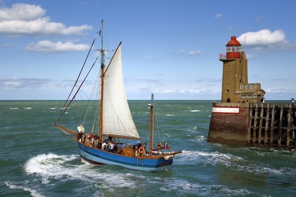 France, Seine Maritime, Pays de Caux, Cote d'Albatre, Fecamp, the old sailing ship Tante Fine leaves the port in front of the Pointe Fagnet lighthouse