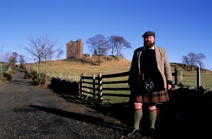 United Kingdom, Scotland, Perthshire and Kinross, Balvaird Castle and its owner wearing a kilt