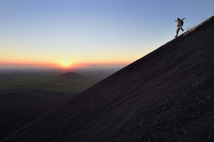 Nicaragua, Leon area, Volcan Cerro Negro in the Cordillera Maribios (or Marrabios), man running down volcano