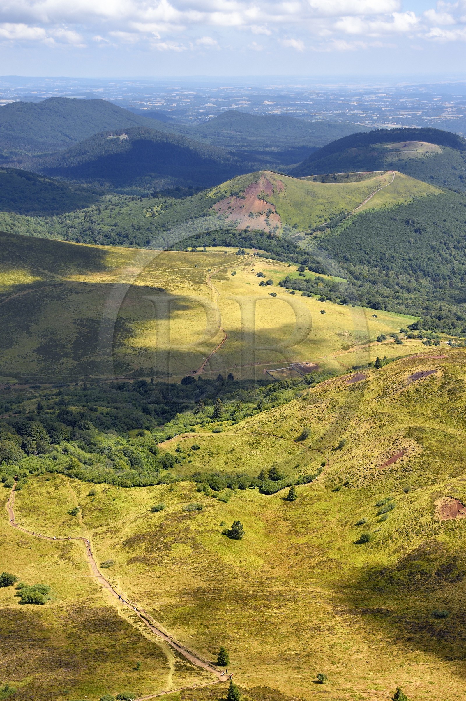 France, Puy de Dome, Parc Naturel Régional des Volcans d'Auvergne (regional nature park of Auvergne volcanoes), the northern part of the Chaine des Puys listed as World heritage by UNESCO, the path leading to the Traversin and the Puy Pariou crater