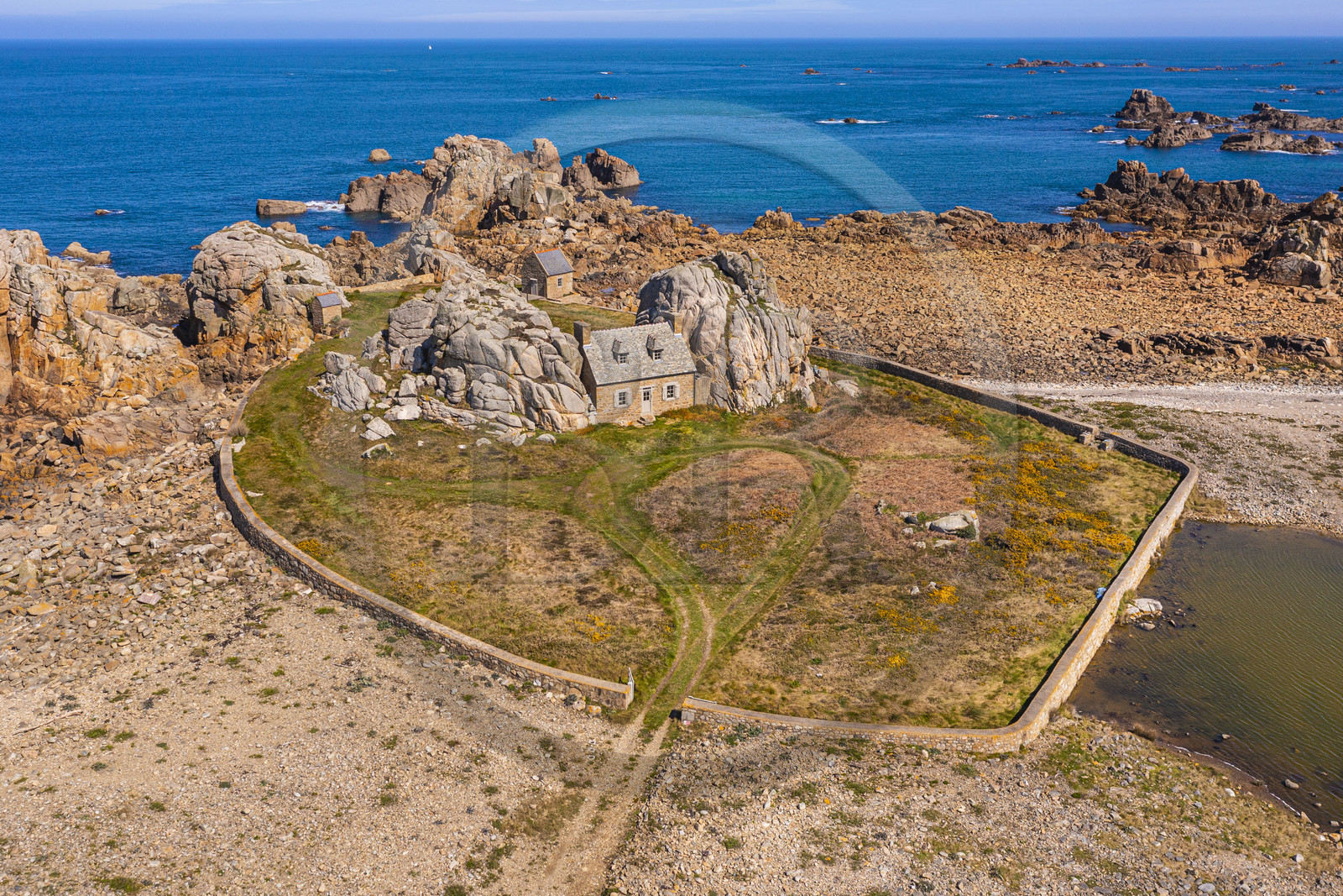 France, Cotes-d'Armor, Cote d'Ajoncs, Plougrescant, site of the Plougrescant Gouffre, the small house of Castel Meur, any representation for commercial use of this house is prohibited (aerial view)