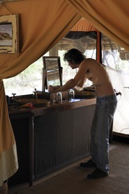 Tanzania, Selous Game Reserve is one of the largest fauna reserves of the world and designated a UNESCO World Heritage Site in 1982, the very exclusive Selous Camp, one of the 13 vast luxury tents raised onto wooden platforms with palm canopies