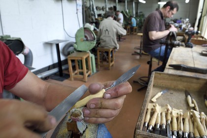 France, Dordogne, Périgord Vert, Nontron, manufacturing knives in the Coutellerie Nontronaise Factory, finishing the handle