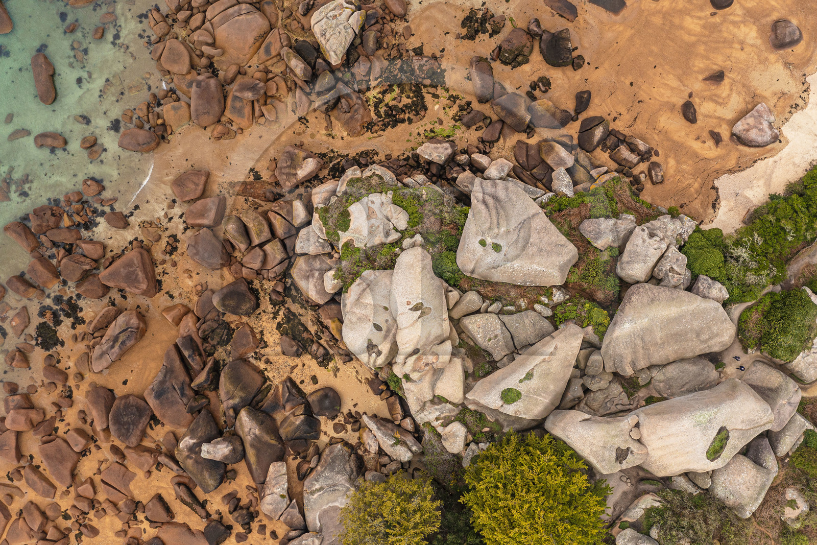 France, Cotes-d'Armor, Cote de Granit Rose, Trégastel, Renote island, hikers in the granite chaos (aerial view)
