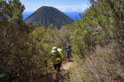 Italy, Sicily, Aeolian Islands, listed as World Heritage by UNESCO, Salina Island, hikers climing Monte Fossa delle Felci and Monte dei Porri in the background