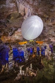 France, Gard, Mejannes-le-Clap, grotte de La Salamandre (Salamander cave), discovery of the cave in Aéroplume®, an individual dirigible balloon inflated with helium which allows you to fly away by flapping your wings