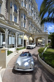 France, Alpes-Maritimes, Cannes, the Carlton palace on the boulevard de la Croisette, aboard a collection convertible Porsche Speedster 356