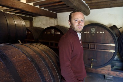 France, Calvados, Pays d'Auge, Saint Cyr du Ronceray, Jean-Roger Groult producer of the Calvados Roger Groult AOC Pays d'Auge for five generations, barrels in aging cellars