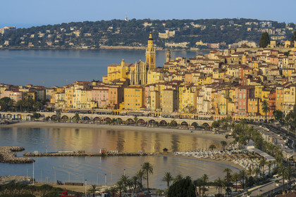 France, Alpes-Maritimes, Menton, the Sablettes beach at the foot of the old town overlooked by the Basilica of Saint Michael