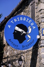 France, Haute Corse, Corsica emblem of the Moorish head on a local brewery advertising