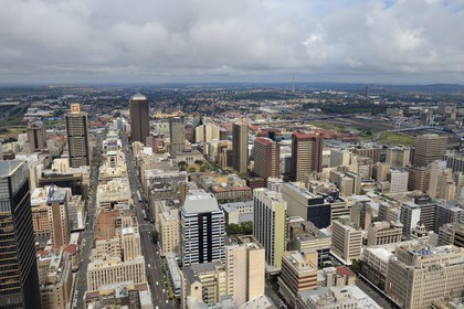 South Africa, Gauteng Province, Johannesburg, CBD (Central Business District), downtown view from the Carlton Center tower with gold mine's spoil tip of Soweto left and Nelson Mandela Bridge right in the background