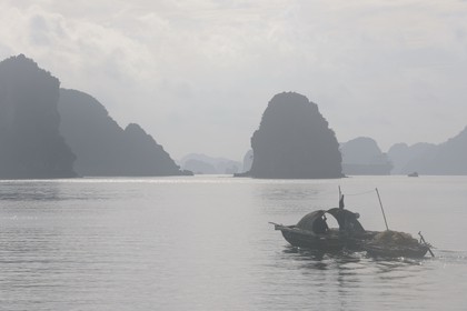 Vietnam, Quang Ninh Province, Halong Bay, listed as World Heritage by UNESCO, fishing boat