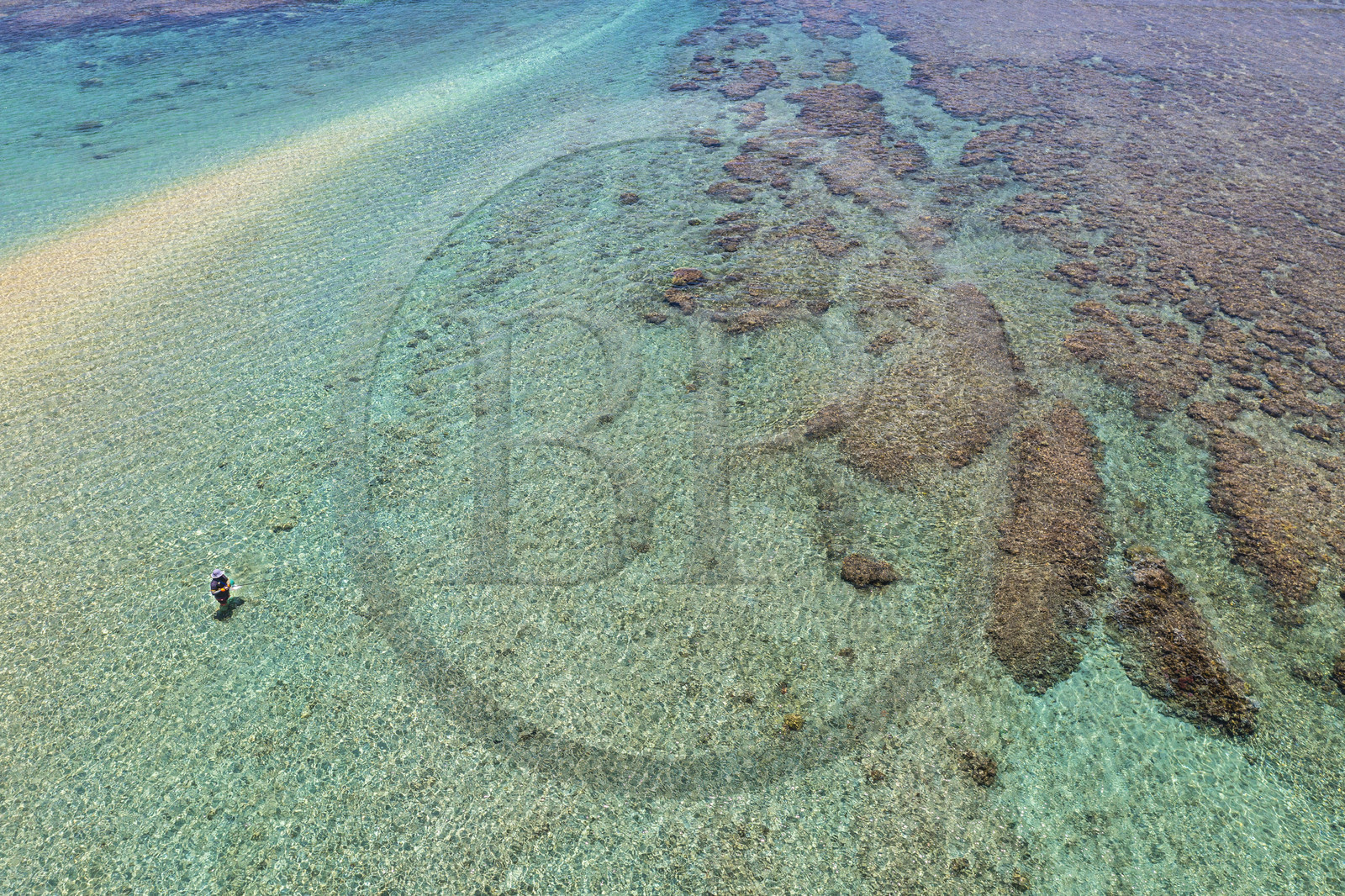 France, Reunion Island (French overseas department), West Coast, Saint Gilles les Bains lagoon beach at Ermitage les Bains, fisherman in the lagoon by the Passe de l'Ermitage (aerial view)