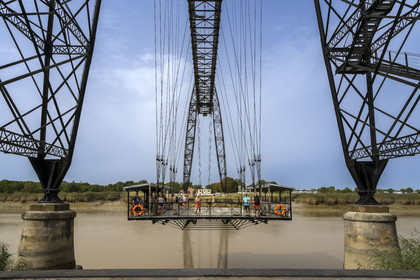 France, Charente Maritime, Rochefort, the Rochefort (or Martrou) transporter bridge built by Ferdinand Arnodin in 1900, the nacelle is in translation above the Charente river
