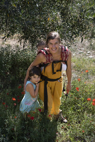 Italy, Liguria, Cinque Terre National Park listed as World Heritage by UNESCO, village of Monterosso al Mare, Farm the Brucaolivo, Costanza Lari entretien ses oliviers avec son bébé dans le dos