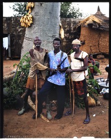 Burkina Faso, Poni province, Lobi land, Loropéni, Houliene Kambou with one of his sons and one of his brothers, armed with bows and arrows but also with a rifle