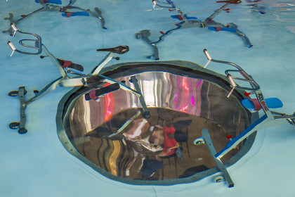 France, Herault, Montpellier, Port Marianne district, Le Nuage building by designer Philippe Starck, aquabike center in the pool upstairs, above the Avva Garden restaurant visible through two large portholes