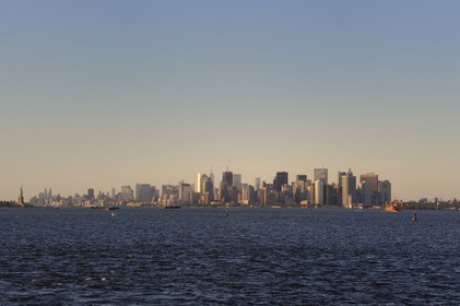 United States, New York, southern tip of Manhattan, Financial District buildings and Statue of Liberty