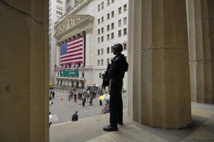 United States, New York, Manhattan, heavy armed police officer in front of the Wall Street Stock Exchange