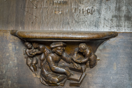 France, Yonne, Auxerre, Saint-Etienne Cathedral, sculpture of the seat of a stall representing the future bishop Jacques Amyot, still tutor to the children of Catherine de Medici