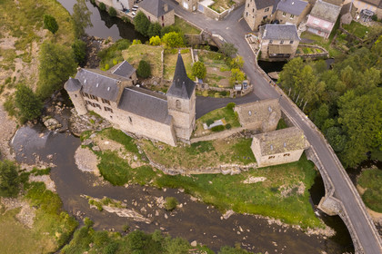 France, Lozere (48), Parc naturel régional de l'Aubrac (Aubrac Regional Nature Park), Saint Juery, the church surrounded by the Bès river (aerial view)