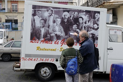 France, Herault, Sete, le restaurant Les Amis de Georges Brassens on a poster on a van